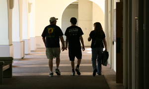 photo of family walking down breezeway on campus