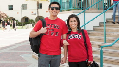 Photo: Two students in SDSU t-shirts 