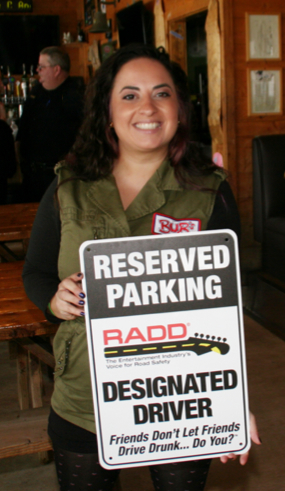 RADD student holding designated driver sign